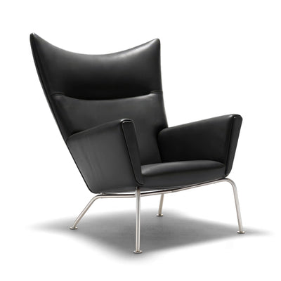 Carl Hansen & Søn CH445 Wing Chair by Hans J. Wegner. Black leather chair with curved backrest and metal legs.