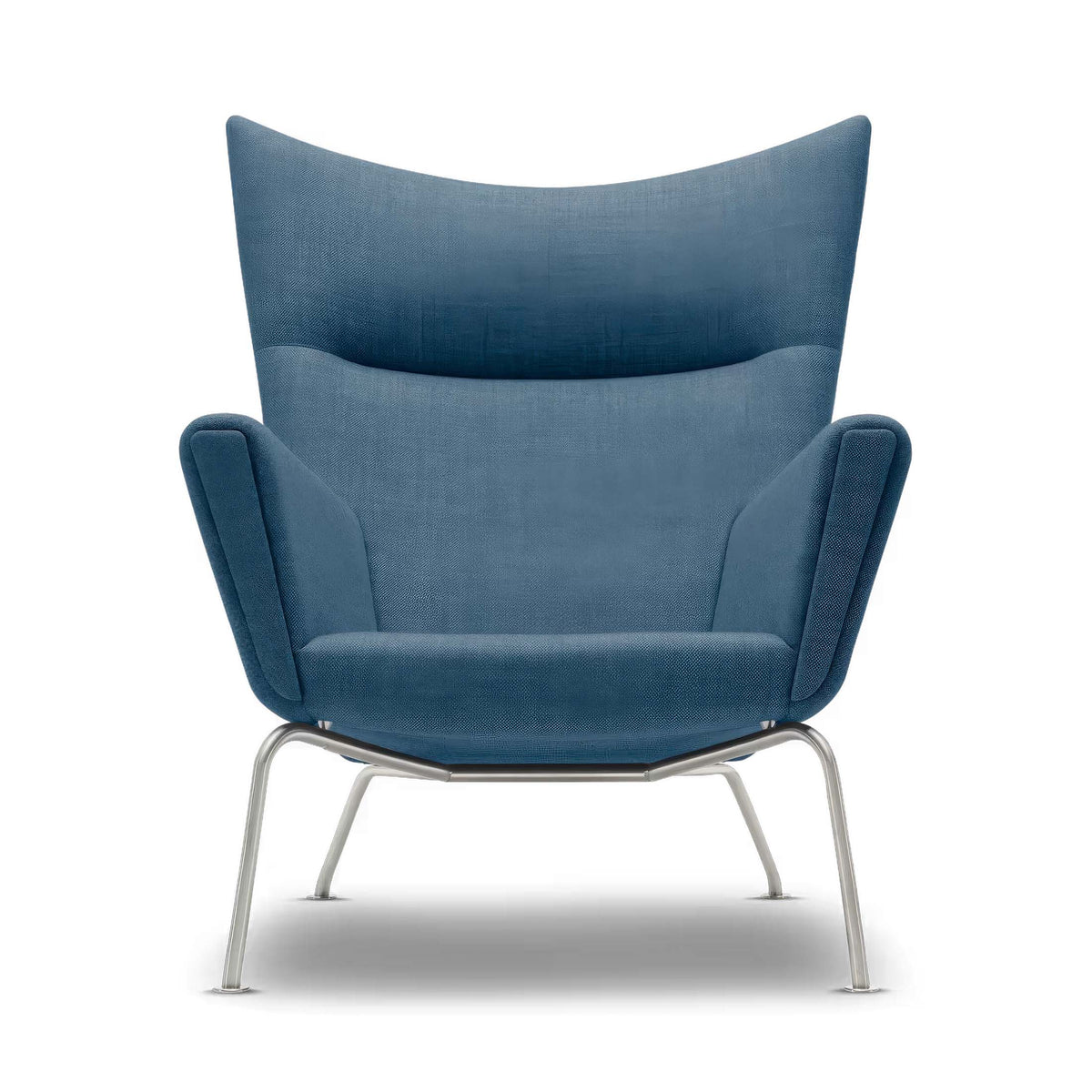 Carl Hansen & Søn CH445 Wing Chair by Hans J. Wegner. A blue upholstered chair with curved wings and metal legs.
