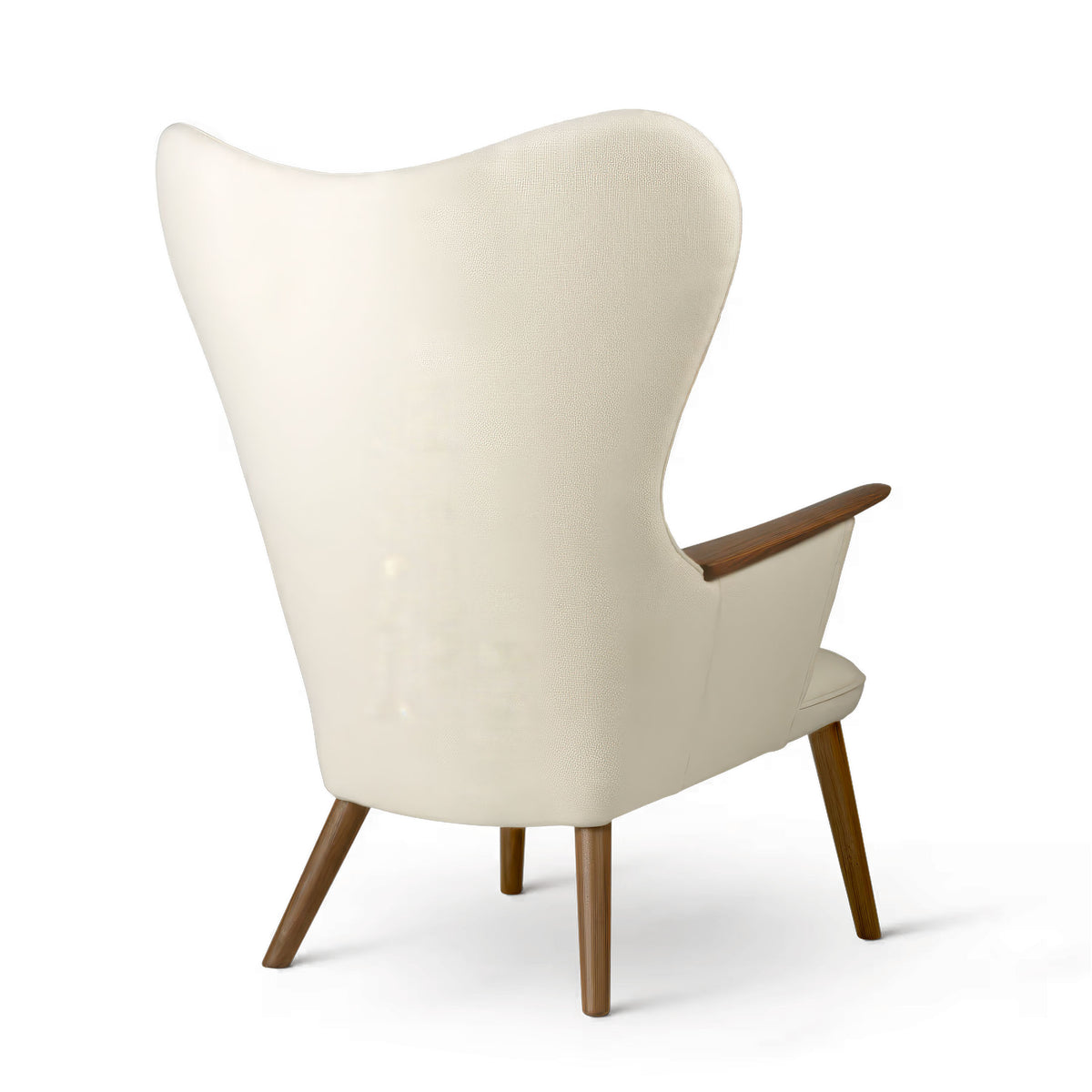 Carl Hansen & Søn CH78 Mama Bear Chair by Hans J. Wegner. A cream-upholstered wingback chair with wooden armrests and legs.