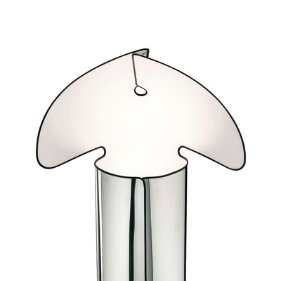 Flos Chiara Floor by Mario Bellini. A white fabric lampshade with curved sides sits atop a cylindrical base.