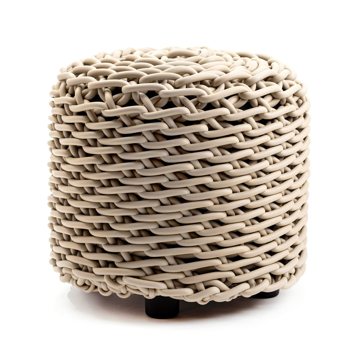 COVO Cilindro Pouf. A cylindrical woven basket in natural beige tones sits on small black feet against a white background.