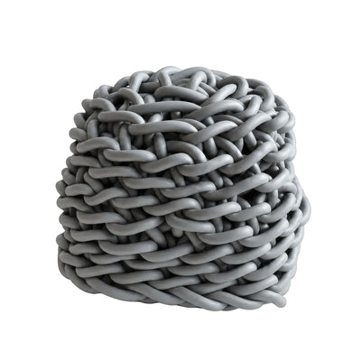 COVO Colosso pouf by Rosanna Contadini. Grey braided cords are densely woven into a compact cylindrical knot.