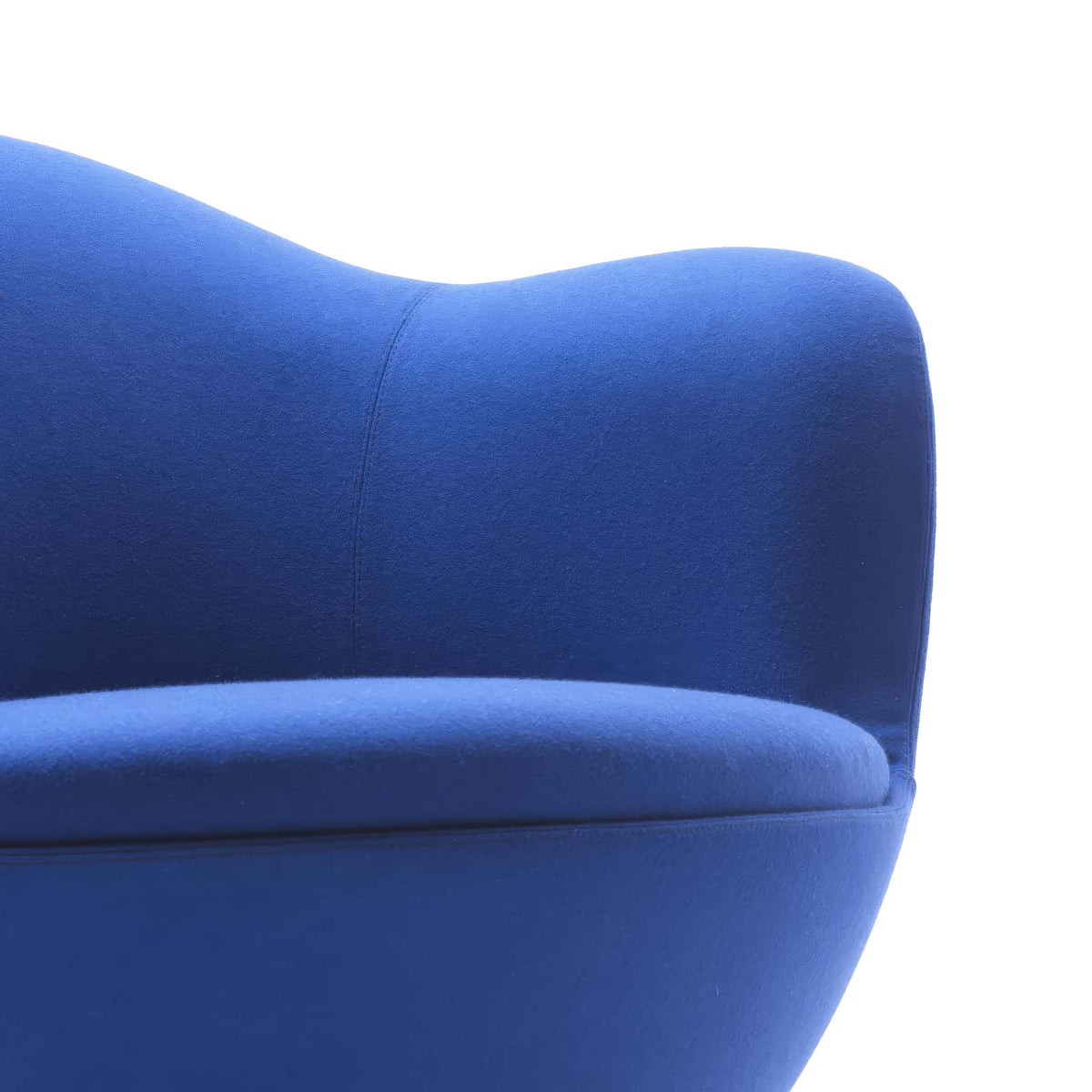 Cappellini Dalia by Marcel Wanders. A plush blue fabric chair with curved organic lines against a white background.