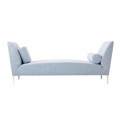 Cappellini Daybed by Jasper Morrison. A light blue upholstered daybed with angled armrests and cylindrical pillows.