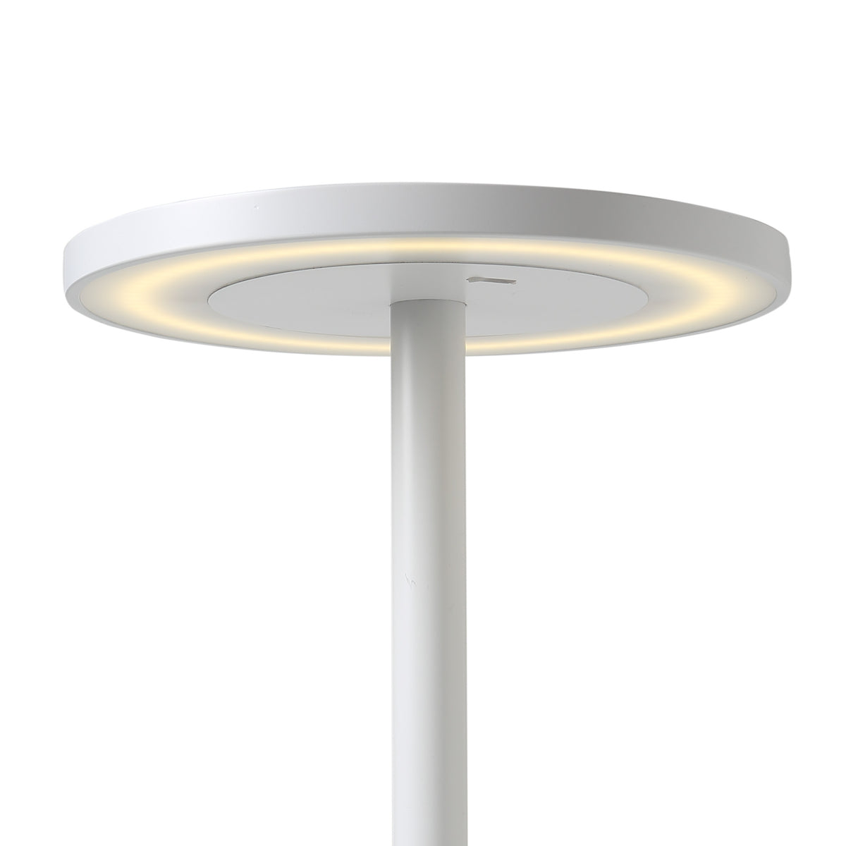 COVO Edvige by Enzo Calabrese. A sleek white pole lamp with a glowing circular disc emits warm light.