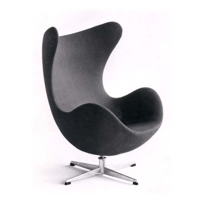 Fritz Hansen Egg™ Chair - 3316 by Arne Jacobsen. A sleek black chair with curved wool upholstery sits on a modern metal base.