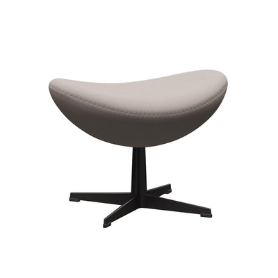 Fritz Hansen Egg™ Foot Stool - 3127 by Arne Jacobsen. Gray fabric seat on black pedestal base.