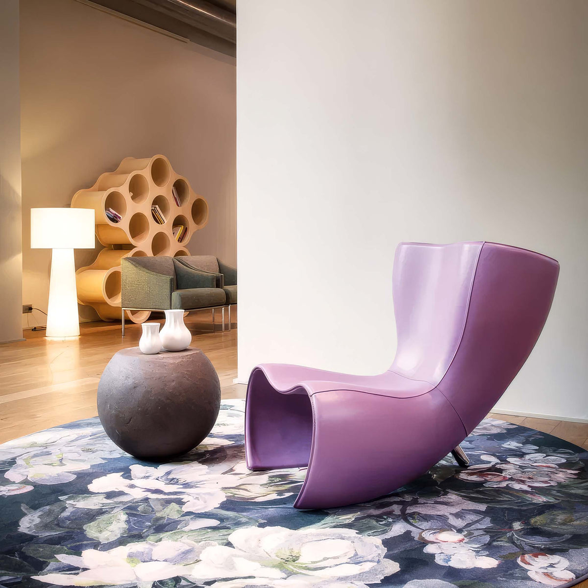 Cappellini Felt Chair by Marc Newson. A sculptural purple chair sits on a floral patterned rug in a modern gallery space.