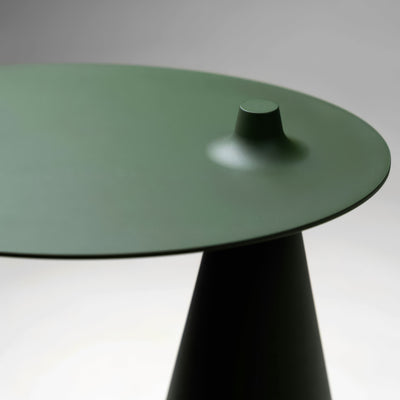 Established & Sons Fez Side Table by Nao Tamura. A minimalist table with a sage green glass top and dark conical base.