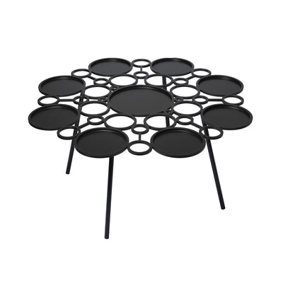 COVO Floret Table by Marta Laudani. A black metal table features circular platforms arranged in a geometric pattern.