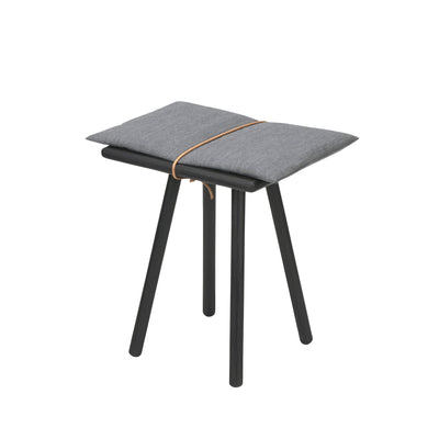 Fritz Hansen Georg Stool by Chris Liljenberg Halstrøm. Black wooden stool with gray cushioned seat and tan leather strap.