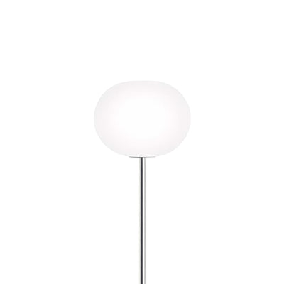 Flos Glo-Ball Floor 1 by Jasper Morrison. A sleek chrome stem supports a frosted white glass globe lamp.