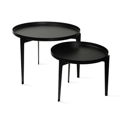 COVO Illusion - Two in One by Minna Niskakangas. Two black round tables with sleek metal frames and matte surfaces.