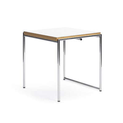 ClassiCon Jean Table by Eileen Gray. A compact table with a white top, wooden edge trim, and polished metal legs.