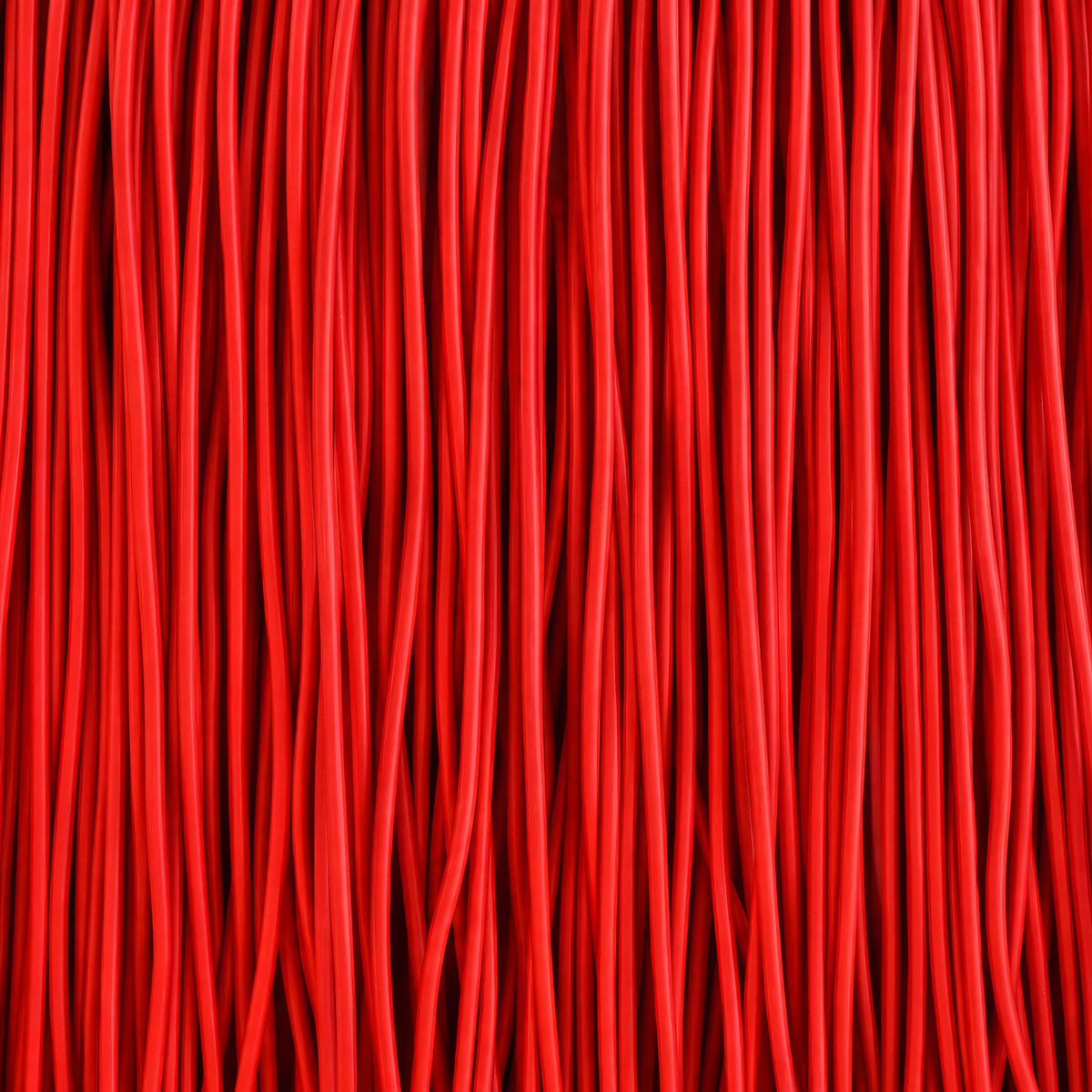 COVO Jelly Pouf by Rosanna Contadini. Luxurious red fabric with deep vertical pleats and rich shadows.