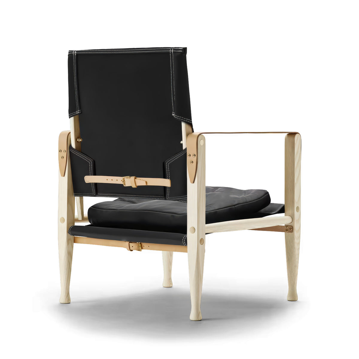 Carl Hansen & Søn KK47000 Safari Chair by Kaare Klint. Black leather chair with natural wood frame and brass hardware.
