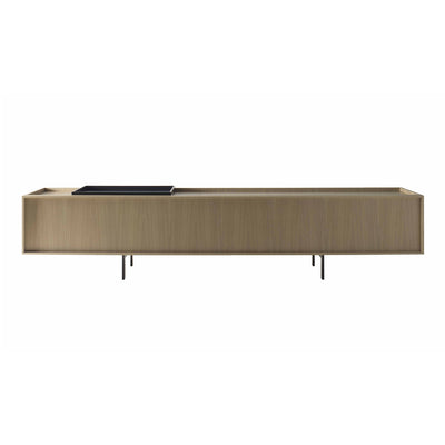 Cappellini Lochness Cabinet by Piero Lissoni. A light wood credenza with metal legs holds a black tray on top.