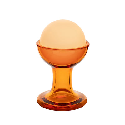Established & Sons Gelato Lamp by Carlo Nason. An amber glass orb sits atop a matching pedestal base with warm orange tones.