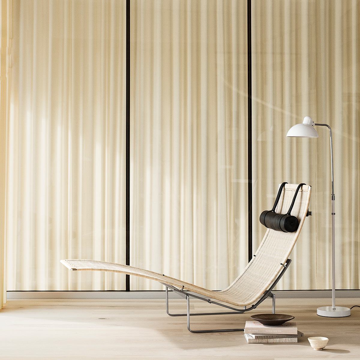 Mobile / PK24 Lounge Chair, designed by Poul Kjærholm and made by Fritz Hansen
