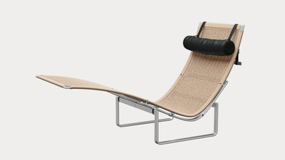Desktop / PK24 Lounge Chair, designed by Poul Kjærholm and made by Fritz Hansen