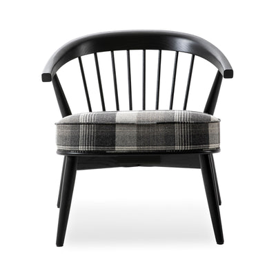 Cappellini Newood Relax by BrogliatoTraverso. Black wooden chair with plaid gray seat cushion and vertical spindle backrest.