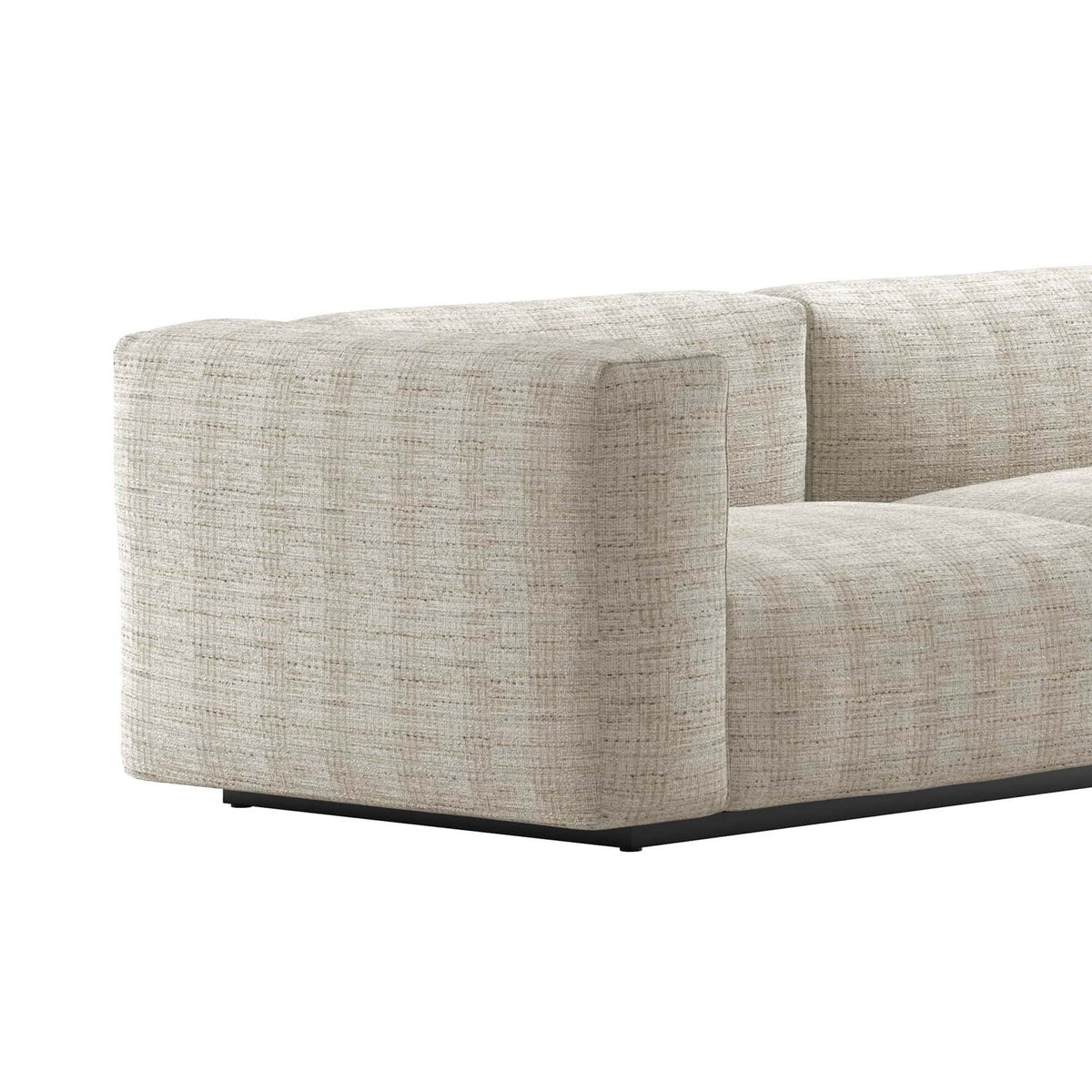 Cappellini Oblong Plus by Jasper Morrison. A beige textured fabric sectional sofa features clean lines and a black base.