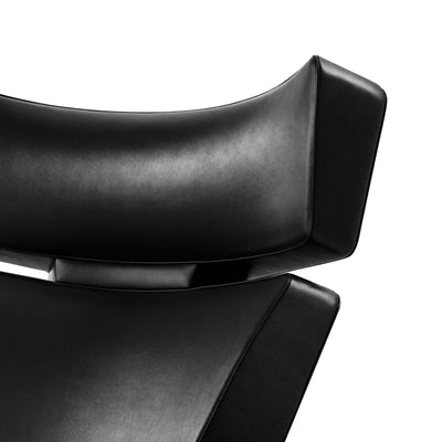 Fritz Hansen Oksen™ Armchair 4201 by Arne Jacobsen. Black leather curves elegantly against white background.