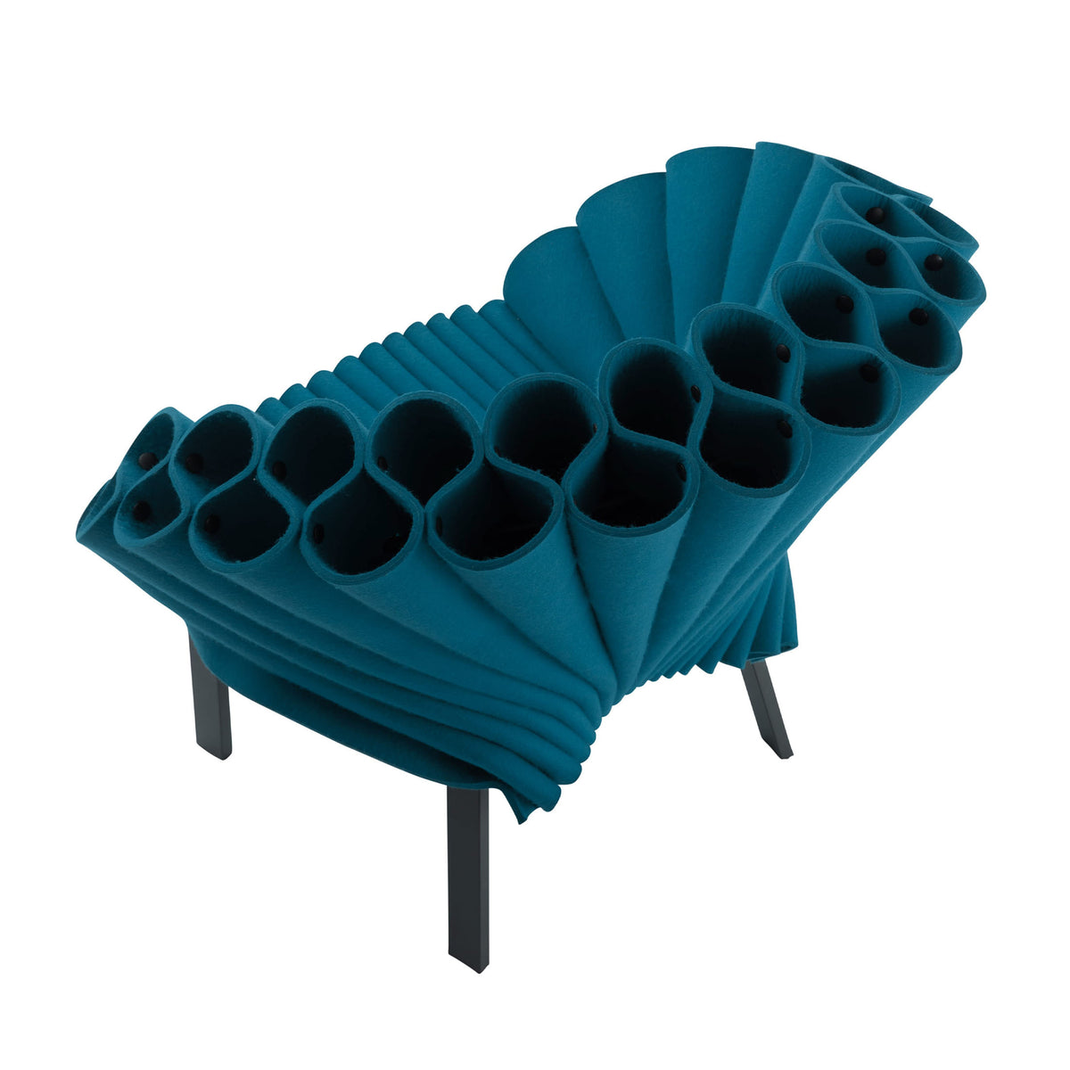 Cappellini Peacock by Dror. A teal fabric chair with cylindrical cutouts sits on dark wooden legs.