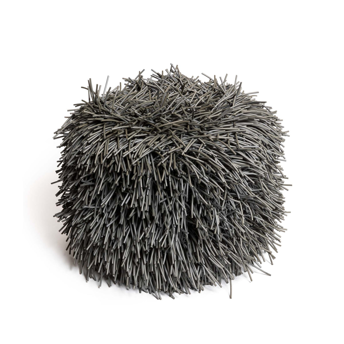 COVO Porcupine Pouf by Rosanna Contadini. A dense, spherical cluster of gray synthetic fibers radiates outward.