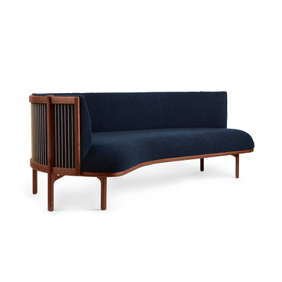 Carl Hansen & Søn RF1903R Sideways Sofa by Rikke Frost. Dark blue upholstery contrasts with warm wood frame and spindles.