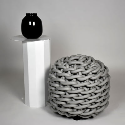 COVO Rebels 1 Pouf by Rosanna Contadini. A glossy black sphere sits atop a white cylinder beside a gray woven orb.