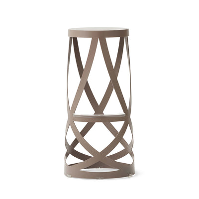 Cappellini Ribbon by Nendo. A taupe cylindrical table features geometric X-pattern cutouts throughout its frame.