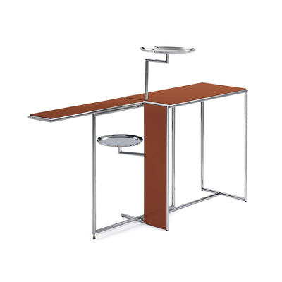 ClassiCon Rivoli by Eileen Gray. A modern chrome and rust-colored desk features multiple work surfaces and attached trays.
