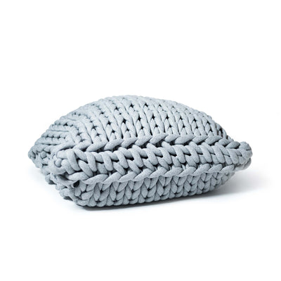 COVO Roxy Maxi Cushion by Rosanna Contadini. A light blue chunky knit pillow sits on a white background.