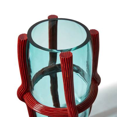 Cassina Sestiere Vases by Patricia Urquiola. A light blue glass vessel with red ribbed metal handles and bands.