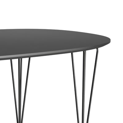 Fritz Hansen Superellipse™ B611 Table by Piet Hein. A sleek dark gray oval table with thin metal legs.