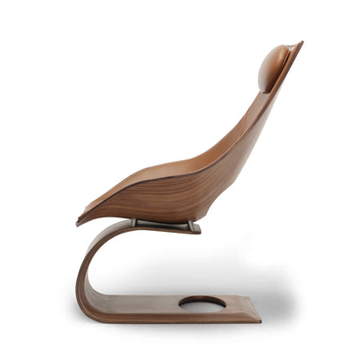 Carl Hansen & Søn TA001P Dream Chair by Tadao Ando. A curved wooden chair with warm brown tones and a sleek, modern design.