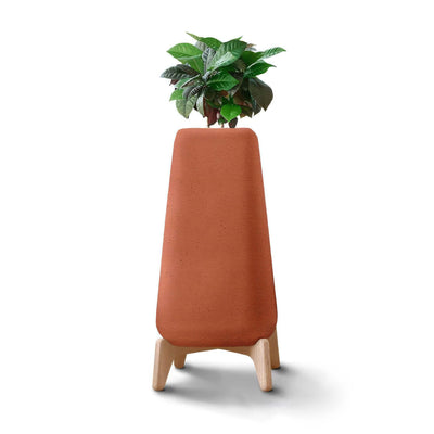 Indigenus Terra by Laurie Wiid van Heerden. A potted plant sits in a terracotta planter with wooden legs.