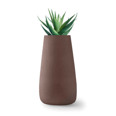 Indigenus Tuber by Haldane Martin. A succulent plant with green spiky leaves sits in a taupe concrete pot.