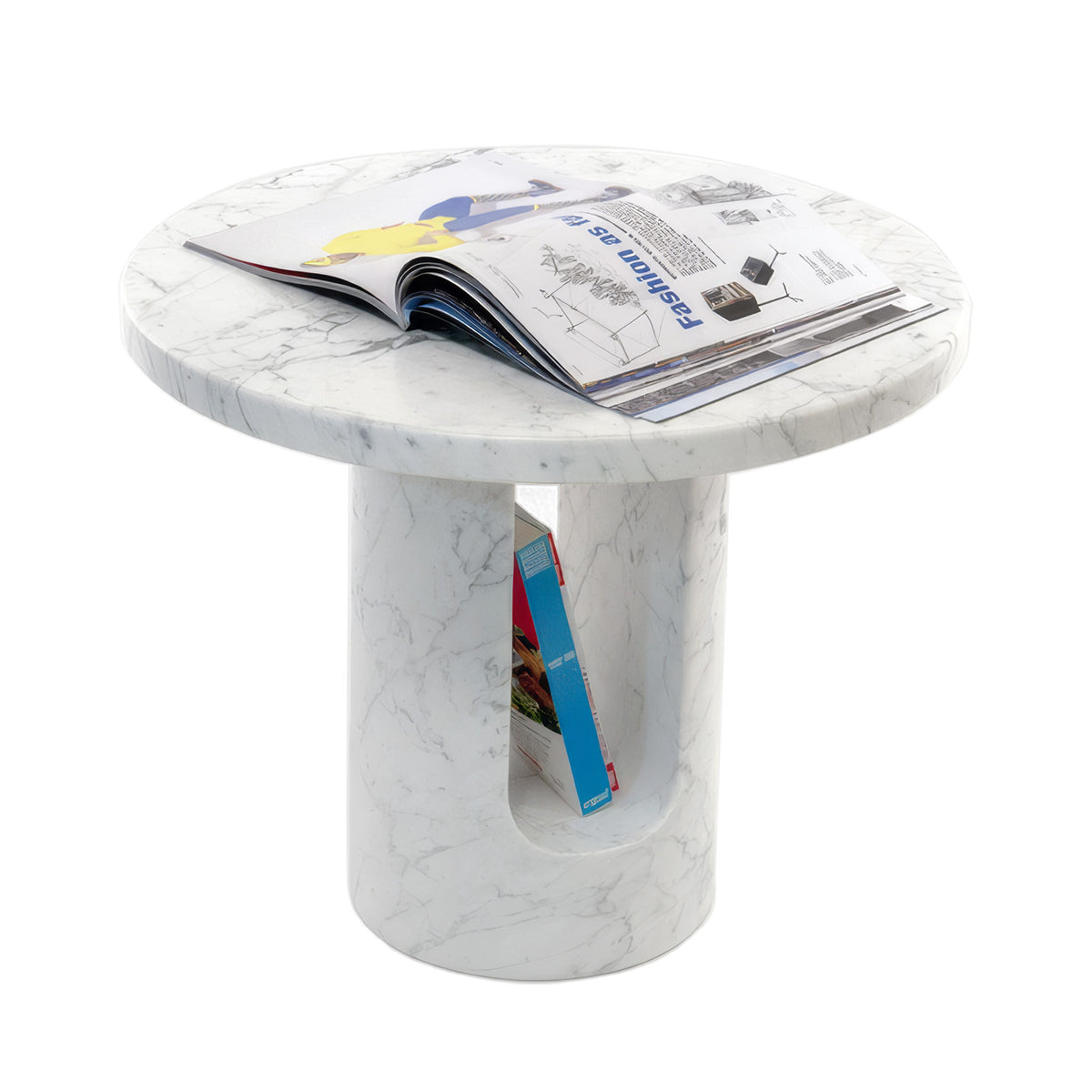 COVO U-TURN Table by Mikko Laakkonen. A white marble round table holds open magazines and displays modern elegance.