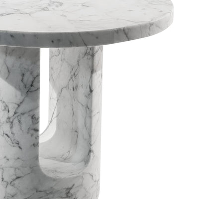 COVO U-TURN Table by Mikko Laakkonen. A round marble table with veined white and gray stone throughout.