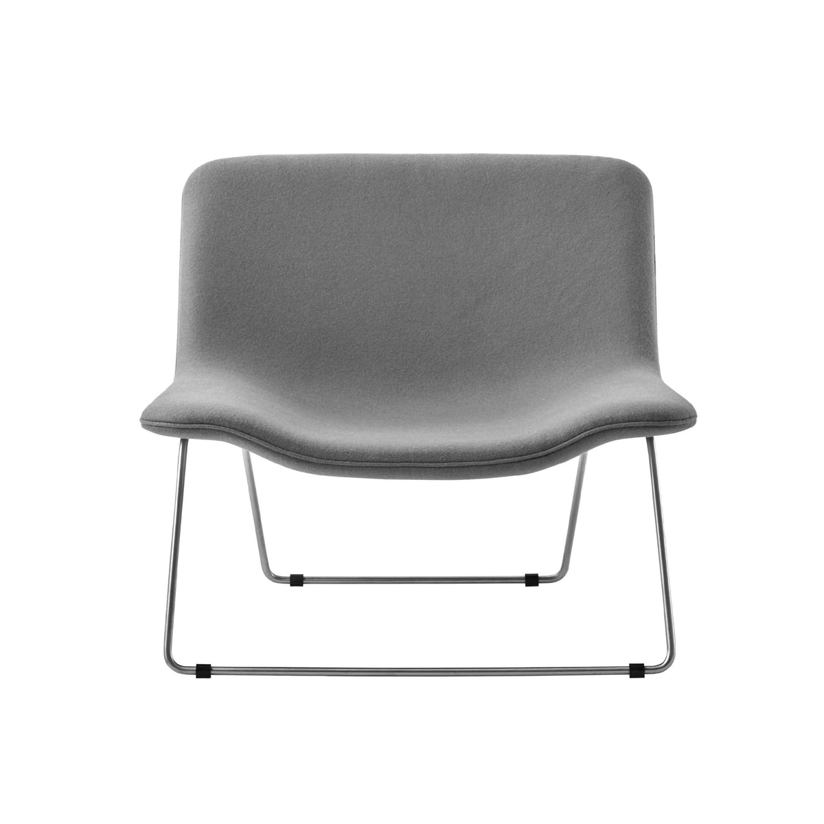 Cappellini Spring by Erwan & Ronan Bouroullec. A gray upholstered chair with a curved seat and metal sled base.