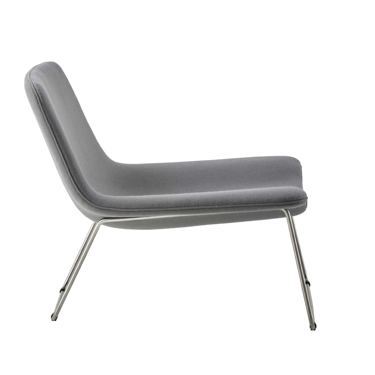 Cappellini Spring by Erwan & Ronan Bouroullec. A gray upholstered lounge chair with sleek metal legs.