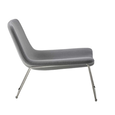 Cappellini Spring by Erwan & Ronan Bouroullec. A gray upholstered lounge chair with sleek metal legs.