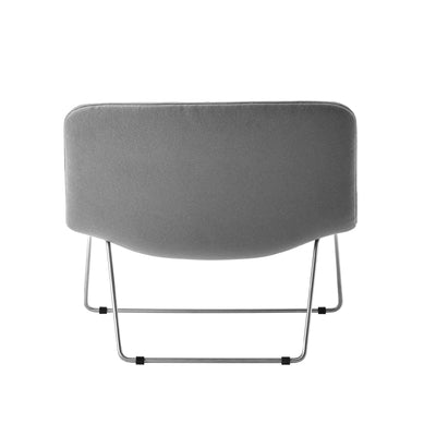 Cappellini Spring by Erwan & Ronan Bouroullec. A gray upholstered chair with metal legs shown from behind.